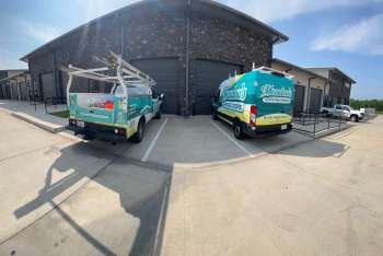 Garage Door Trucks Parked Outside Commercial Property