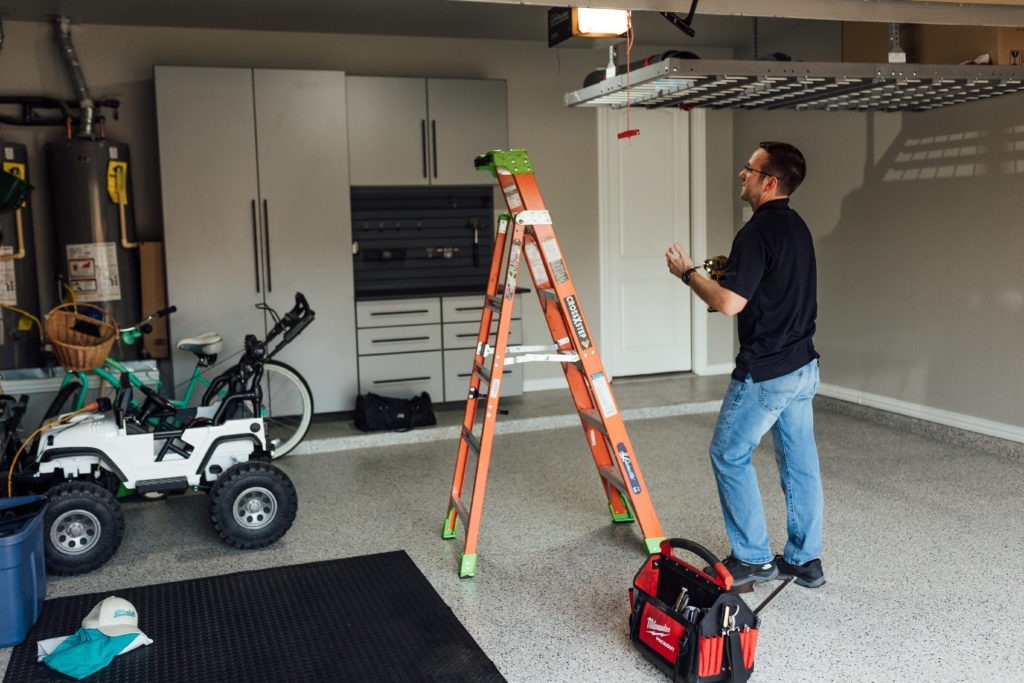 Meadows Company Installing Garage Door 